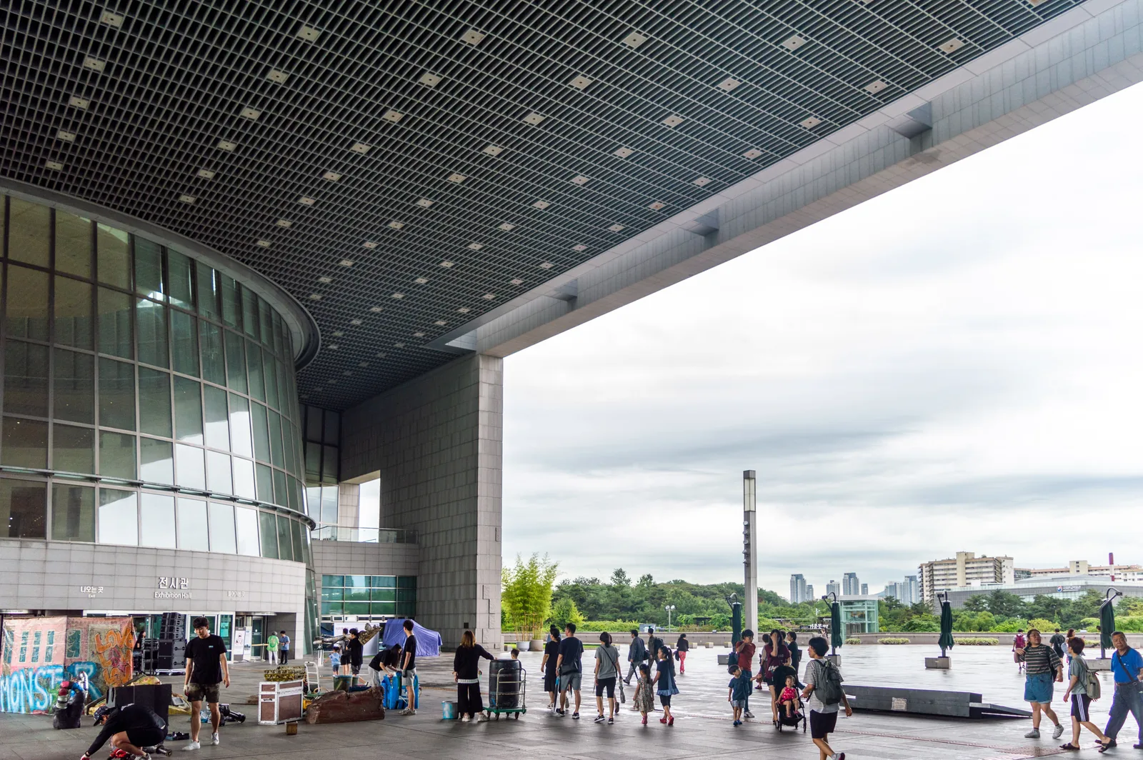 Visitors beneath the entrance canopy of the National Museum of Korea in Yongsan, Seoul